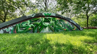 Green and Light Green and Grey Stylewriting by Sainter. This Graffiti is located in Bratislava, Slovakia and was created in 2023. This Graffiti can be described as Stylewriting and 3D.