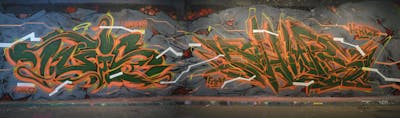 Green and Orange and Grey Stylewriting by smo__crew, TUIS and Chips. This Graffiti is located in London, United Kingdom and was created in 2022. This Graffiti can be described as Stylewriting and Wall of Fame.