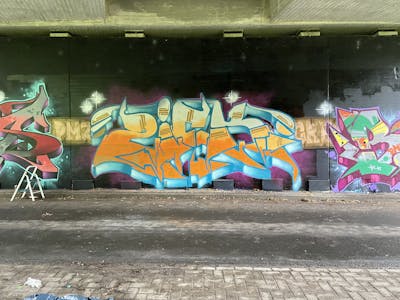 Orange and Light Blue Stylewriting by ZICK. This Graffiti is located in Wilhelmshaven, Germany and was created in 2022. This Graffiti can be described as Stylewriting, Characters and Wall of Fame.