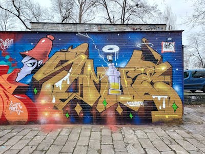 Brown and Blue Stylewriting by Fems173. This Graffiti is located in lublin, Poland and was created in 2023. This Graffiti can be described as Stylewriting, Characters and Wall of Fame.