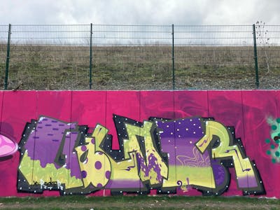 Violet and Light Green Stylewriting by Gauner. This Graffiti is located in Germany and was created in 2024. This Graffiti can be described as Stylewriting and Wall of Fame.