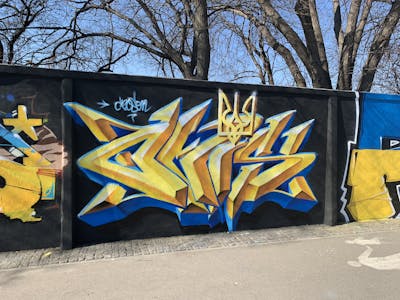 Blue and Yellow Stylewriting by Czosen1. This Graffiti is located in Warsaw, Poland and was created in 2022. This Graffiti can be described as Stylewriting, Wall of Fame and 3D.