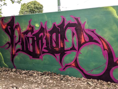 Violet and Green Stylewriting by Cc_pinturas. This Graffiti is located in Murwillumbah, Australia and was created in 2021. This Graffiti can be described as Stylewriting and Wall of Fame.