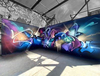 Colorful Stylewriting by Rymd and Rymds. This Graffiti is located in Stockholm, Sweden and was created in 2022. This Graffiti can be described as Stylewriting, Abandoned and Futuristic.