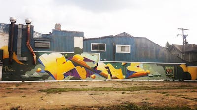 Yellow and Colorful Stylewriting by Rens. This Graffiti is located in Detroit, United States and was created in 2018. This Graffiti can be described as Stylewriting, Abandoned and Murals.