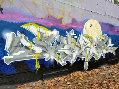 Grey and Colorful Stylewriting by KESOM. This Graffiti is located in Berlin, Germany and was created in 2022. This Graffiti can be described as Stylewriting, Characters and Wall of Fame.