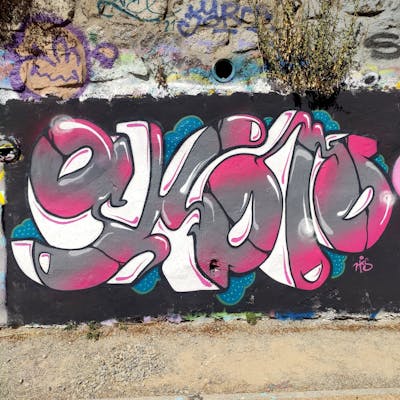 Coralle and Grey Stylewriting by NKS. This Graffiti is located in madrid, Spain and was created in 2022. This Graffiti can be described as Stylewriting and Wall of Fame.