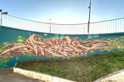 Beige and Cyan and Colorful Stylewriting by Fresk. This Graffiti is located in Poznan, Poland and was created in 2024. This Graffiti can be described as Stylewriting and Wall of Fame.