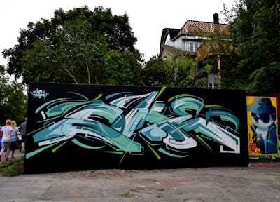 Cyan and White and Black Stylewriting by Coke. This Graffiti is located in copenhagen, Denmark and was created in 2017. This Graffiti can be described as Stylewriting and Characters.