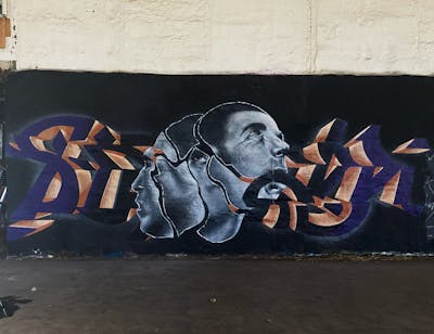 Grey and Violet and Orange Stylewriting by Sirom. This Graffiti is located in Germany and was created in 2023. This Graffiti can be described as Stylewriting, Characters and Abandoned.