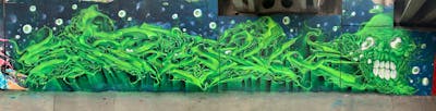 Light Green and Colorful Stylewriting by Fresk. This Graffiti is located in Poznan, Poland and was created in 2021. This Graffiti can be described as Stylewriting, Characters and Wall of Fame.
