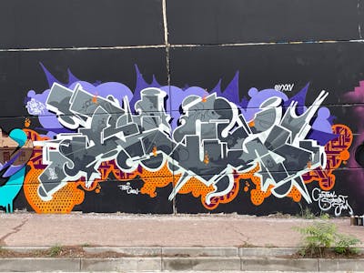 Grey and Colorful Stylewriting by OneBlow and blow. This Graffiti is located in Barcelona, Spain and was created in 2022.