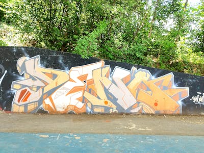 Beige and Orange and Grey Stylewriting by Deno. This Graffiti is located in Lovran, Croatia and was created in 2023.