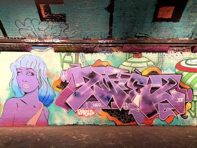 Violet and Colorful Stylewriting by 2nez. This Graffiti is located in London, United Kingdom and was created in 2022. This Graffiti can be described as Stylewriting, Characters and Wall of Fame.