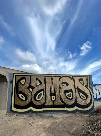 Gold and Beige and Black Stylewriting by Bamos. This Graffiti is located in Valencia, Spain and was created in 2023.