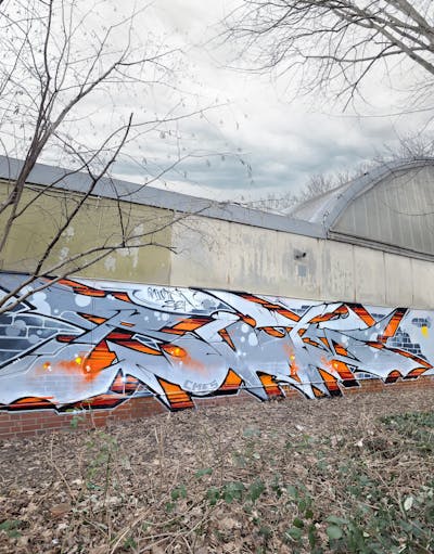 Grey and Orange Stylewriting by Riots. This Graffiti is located in Leipzig, Germany and was created in 2024.