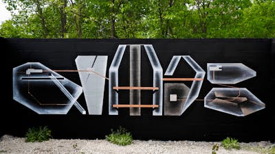 White and Grey and Black Stylewriting by Qumes. This Graffiti is located in Detroit, United States and was created in 2023. This Graffiti can be described as Stylewriting and Futuristic.