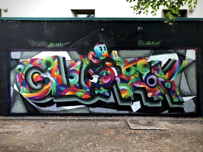 Colorful and Grey Stylewriting by Glurak. This Graffiti is located in Berlin, Germany and was created in 2022. This Graffiti can be described as Stylewriting, Characters and Wall of Fame.