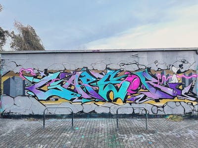 Grey and Colorful and Cyan Stylewriting by Gaps. This Graffiti is located in Leipzig, Germany and was created in 2023. This Graffiti can be described as Stylewriting, Characters and Wall of Fame.