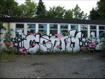 Chrome and Black and Coralle Stylewriting by CONNY. This Graffiti is located in Nürnberg, Germany and was created in 2015. This Graffiti can be described as Stylewriting, Abandoned and Street Bombing.