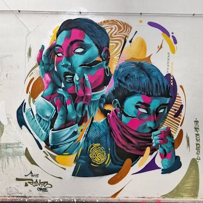 Cyan and Colorful Characters by REVES ONE. This Graffiti is located in Brussels, Belgium and was created in 2022. This Graffiti can be described as Characters and Futuristic.