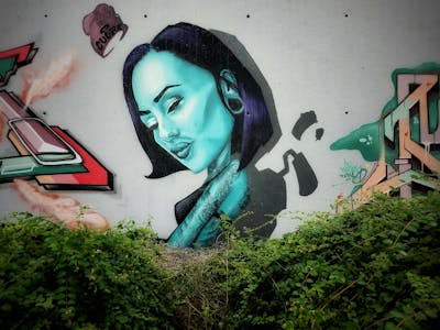 Cyan Characters by CUORE and m4a. This Graffiti is located in Mannheim, Germany and was created in 2023.