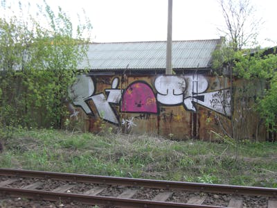 Chrome and Coralle Line Bombing by Riots. This Graffiti is located in Krakow, Poland and was created in 2009. This Graffiti can be described as Line Bombing and Stylewriting.
