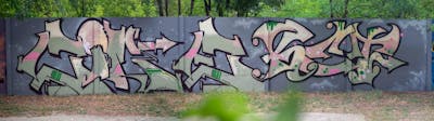 Grey and Beige and Light Green Stylewriting by Cime and Ket. This Graffiti is located in Budapest, Hungary and was created in 2022.