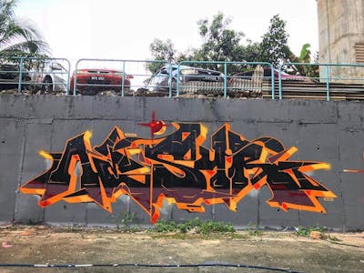 Orange Stylewriting by Nesyr. This Graffiti is located in Kuala Lumpur, Malaysia and was created in 2019. This Graffiti can be described as Stylewriting.