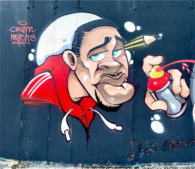 Beige and Red Characters by Mache. This Graffiti is located in Naples, Italy and was created in 2022.