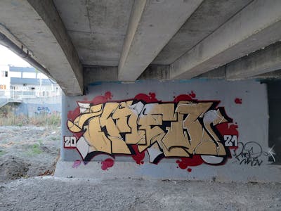 Gold and Red Stylewriting by KNEB. This Graffiti is located in Cyprus and was created in 2021. This Graffiti can be described as Stylewriting and Wall of Fame.