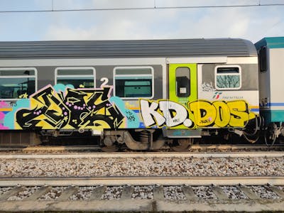 Black and Yellow Trains by KD, Slog175 and DOS. This Graffiti is located in Venice, Italy and was created in 2022. This Graffiti can be described as Trains and Stylewriting.