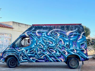 Light Blue and Blue and Violet Stylewriting by Fresco. This Graffiti is located in olhao, Portugal and was created in 2023. This Graffiti can be described as Stylewriting and Cars.