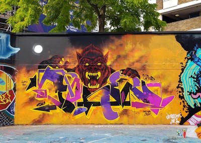Orange and Colorful Stylewriting by smo__crew and Core246. This Graffiti is located in London, United Kingdom and was created in 2022. This Graffiti can be described as Stylewriting, Characters and Wall of Fame.