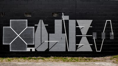 Grey and Black Stylewriting by Qumes. This Graffiti is located in United States and was created in 2024. This Graffiti can be described as Stylewriting and Futuristic.