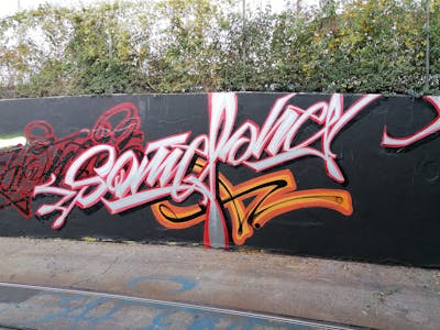 Red and Grey Stylewriting by Someone and Dweks. This Graffiti is located in Basel, Switzerland and was created in 2020. This Graffiti can be described as Stylewriting and Handstyles.