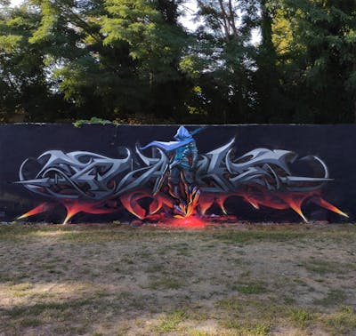 Grey and Red Stylewriting by Rays and Nikt. This Graffiti is located in Potsdam, Germany and was created in 2022. This Graffiti can be described as Stylewriting, Characters and 3D.