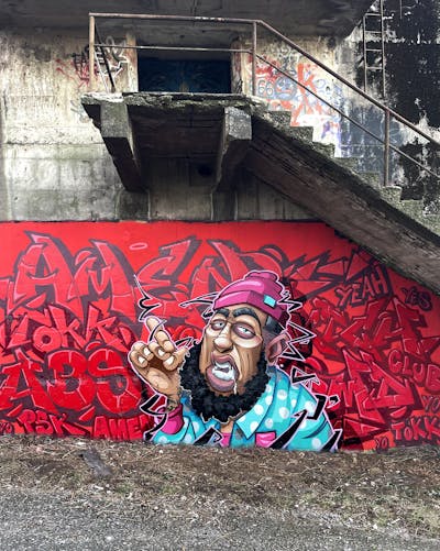 Red and Colorful Stylewriting by Tokk and Amen. This Graffiti is located in Bremen, Germany and was created in 2022. This Graffiti can be described as Stylewriting, Characters, Abandoned and Streetart.