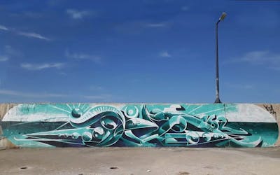 Cyan Stylewriting by sea. This Graffiti is located in Samothrace, Greece and was created in 2021. This Graffiti can be described as Stylewriting, 3D and Special.