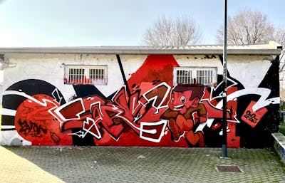 Red and Black and White Stylewriting by ZARK ONER. This Graffiti is located in Milan, Italy and was created in 2023. This Graffiti can be described as Stylewriting and Characters.