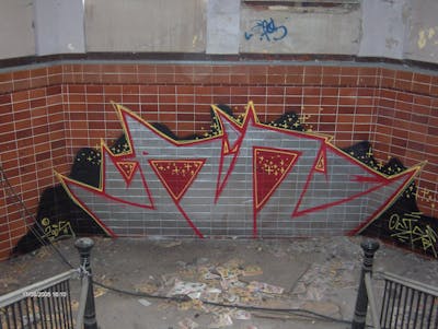 Chrome and Red Stylewriting by urine and OST. This Graffiti is located in Delitzsch, Germany and was created in 2005. This Graffiti can be described as Stylewriting and Abandoned.