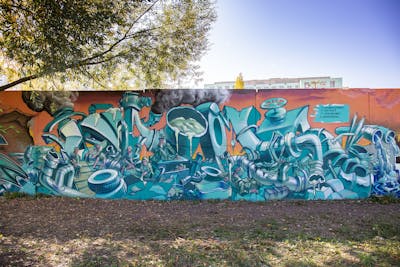 Cyan and Orange Stylewriting by Kame. This Graffiti is located in Berlin, Germany and was created in 2022. This Graffiti can be described as Stylewriting, Characters and Wall of Fame.
