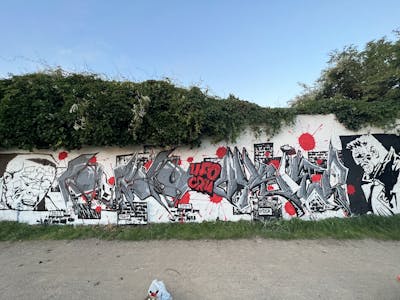 Grey and White and Red Stylewriting by Puke and Vysier64. This Graffiti is located in Lübeck, Germany and was created in 2023. This Graffiti can be described as Stylewriting and Characters.