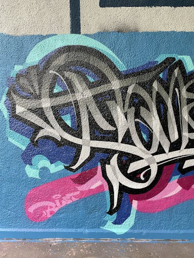 Light Blue and Grey and Coralle Stylewriting by Someone. This Graffiti is located in Basel, Switzerland and was created in 2023. This Graffiti can be described as Stylewriting and Wall of Fame.