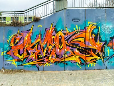 Orange and Colorful and Violet Stylewriting by Wios. This Graffiti is located in Spain and was created in 2024.