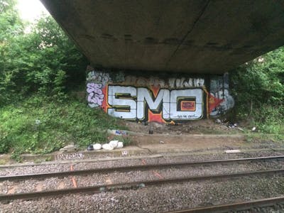 Chrome and Orange Stylewriting by smo__crew. This Graffiti is located in London, United Kingdom and was created in 2023. This Graffiti can be described as Stylewriting and Line Bombing.