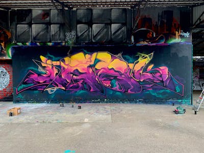 Violet and Orange and Cyan Stylewriting by N3M crew and Jaek. This Graffiti is located in Luxembourg, Iran and was created in 2023. This Graffiti can be described as Stylewriting and Wall of Fame.