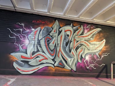 Grey and Violet and Orange Stylewriting by SQWR. This Graffiti is located in United Kingdom and was created in 2023. This Graffiti can be described as Stylewriting and 3D.