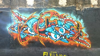 Orange and Cyan Characters by Rafia. This Graffiti is located in Depok, Indonesia and was created in 2013.