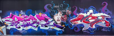Colorful and Violet Stylewriting by dejoe and Cors One. This Graffiti is located in Berlin, Germany and was created in 2022. This Graffiti can be described as Stylewriting and Characters.